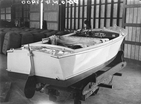 Runabout motor launch on wharf after unloading from ship, 1930s