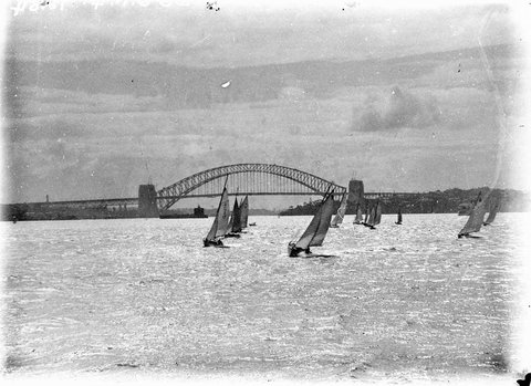 Small yachts amateurs 21 foot restricted class on Sydney Harbour the Bridge in background, 1931–32