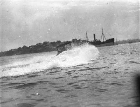 Speedboat 79 almost invisible through a cloud of spray, 1930s