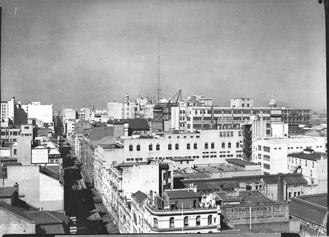 Sydney skyline looking south from Pitt King Streets showing 2UWs radio mast on State Shopping Block, 1944