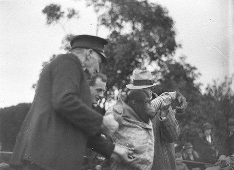 Taronga Park Zoo attendant with clown monkey, 1934