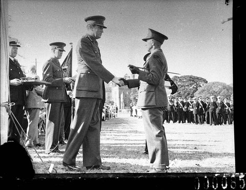 The Governor Lord Wakehurst shakes hands with a recipient St Johns Ambulance parade, 1940