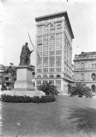 The then new Astor Flats in Macquarie Street showing statue of Albert the Good on left and Premiers Department on right, 1930s