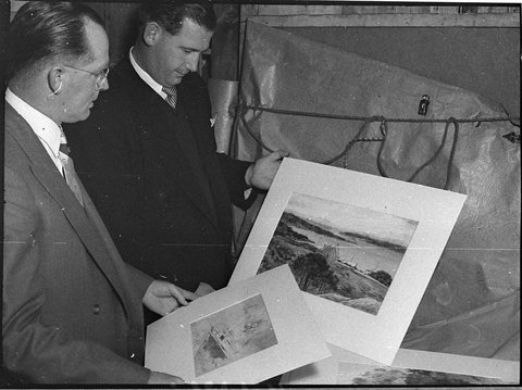 Town Clerk Mr Burges with paintings Pote Collection, 1956