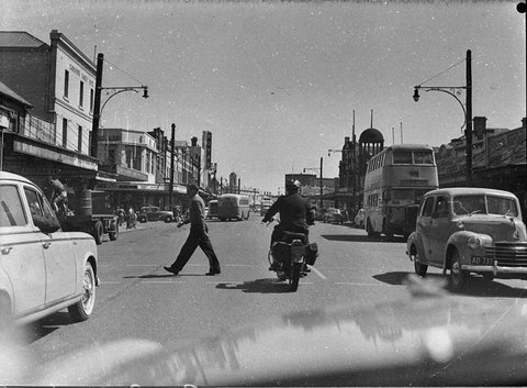 Traffic policeman on patrol duties Hunter Street looking west Steel Street on left, 1957