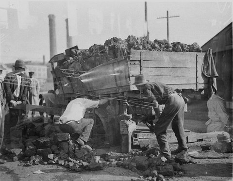 Truck loses its load of rubble, 1930s