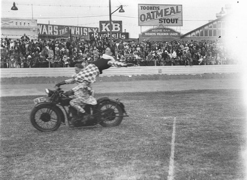 Two clowns on a motorbike thrill the crowds, 1934