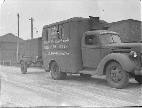 Two Ford mobile cinema units nos 28 111 gifts from Newcastle through ACF NSW Div operated by Australian Army Amenities Services for Miss Davidson Australian Comforts Fund, 1944