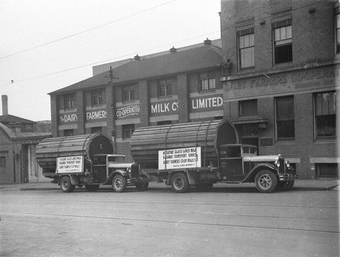 Two of J McFarlands White trucks with new glasslined milk tanks for rail transportation at Dairy Farmers Coop milk depot, 1933–34