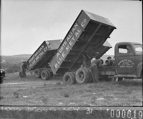 Two of the trucks tipping Australian Blue Metal Co trucks for Mr Freeman Ford News, 1944