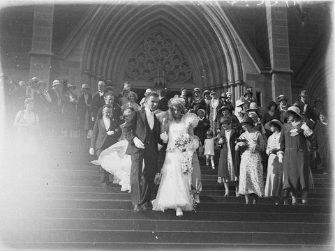 Unidentified bridal couple on steps of St Marys Cathedral, 1930s
