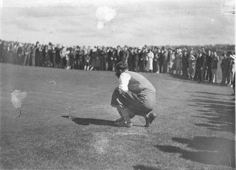 Unidentified golfer lines up a putt, 1934