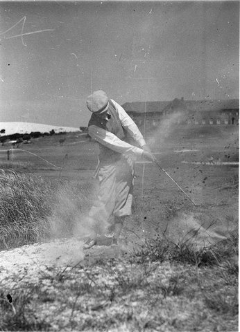Unidentified player hitting out of a bunker at Rose Bay, 1934