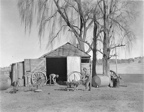 Wheelwrights working on a wagon wheel at Jindabyne, 1930s