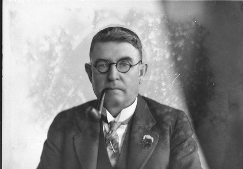 With glasses and a pipe, c. 1925