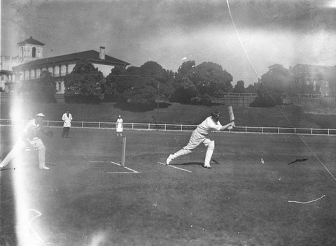 Women cricketers being coached at University Oval, 1920s