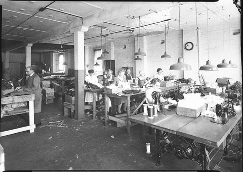 Workers in a clothing factory using power sewing machines Barton Boys or Bays, 1944