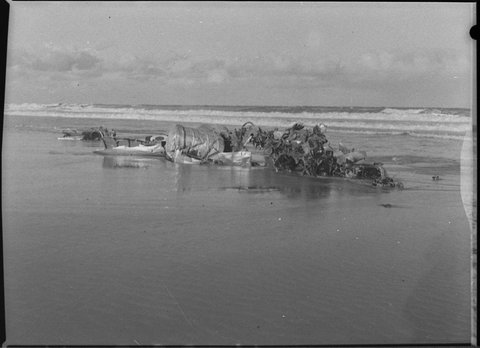 Wreckage of Gloster Meteor jet fighter from Williamtown on beach 12 miles north of Newcastle, 1955