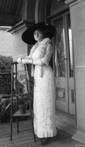 Miss Marcelle Boivin, daughter of the head chef at the Paris House, on the veranda of Ewenton, Balmain, ca. 1912 by Sam Hood, c. 1912