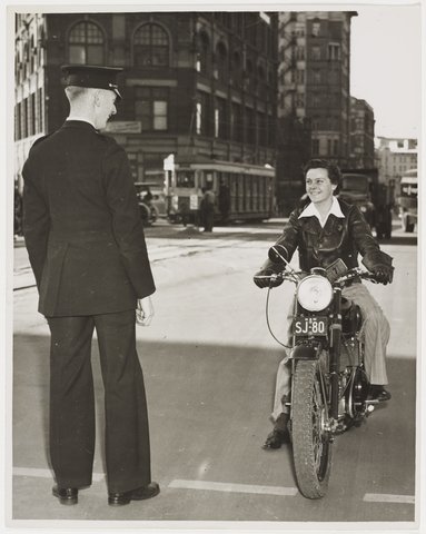 Female motor cyclist, Railway Square, Sydney, n.d., by Ted Hood, 1913–57