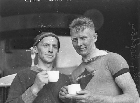 Ernie Milliken and an unknown cyclist enjoy a cup of tea, 1932