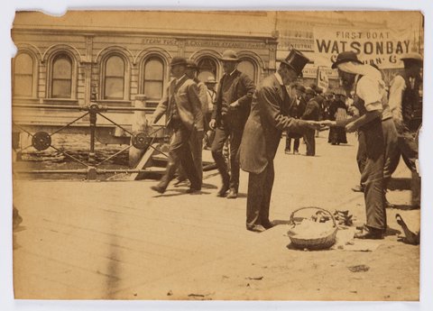 Gentleman paying street merchant, ca. 1880s-1900, 1885–1900