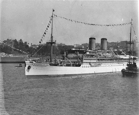 Dutch liner "Nieuw Zeeland" passing the moored HMAS "Canberra", Sydney Harbour Bridge opening, 19 March 1932 - Sam Hood