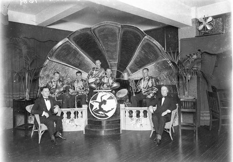 A five piece jazz band in their "music shell', probably Wentworth Hotel, Sydney, 192- - photographer Sam Hood, 1930