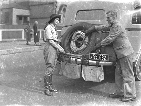 Francis Birtles, his wife of less than two months, Nea, and his touring car in front of the Public Library of New South Wales, Sydney, 9 May 1935 - photographer Sam Hood