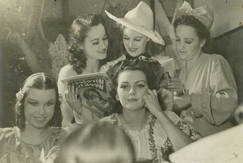 Women performers reading Wireless Weekly and photographed in the mirror, Sydney, ca. 1940 - Nanette Kuehn