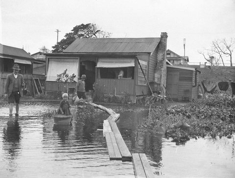 Narrabeen flooding; duck-boards for access, April 1927, by Sam Hood