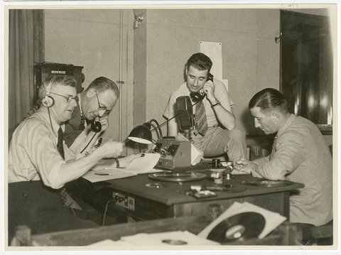 Group of radio producers in a studio, c. 1930s, by Sam Hood