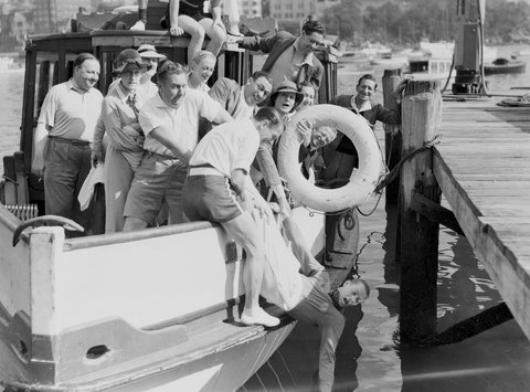 Frank Leighton almost goes in the "drink" on a launch picnic for performers, Sydney, 4 April 1937 - Sam Hood