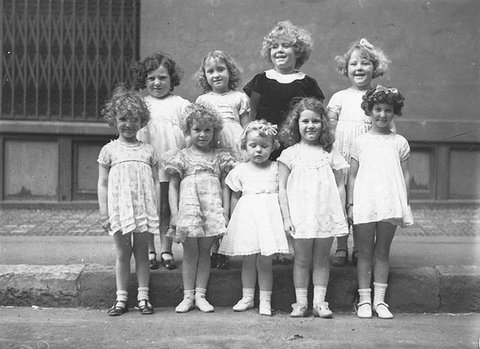 Nine girls in a Fox Films and Daily Telegraph Shirley Temple look-alike contest (100 pounds first prize won by Sybil Frederick of Marrickville), Sydney, 2 October 1934 - by Sam Hood