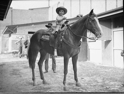 Little cowboy on horse, 22-4-1935 - by Sam Hood