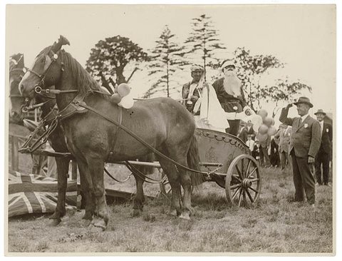 Santa arrives in a chariot driven by a "sheik", n.d. - by Sam Hood, 1930
