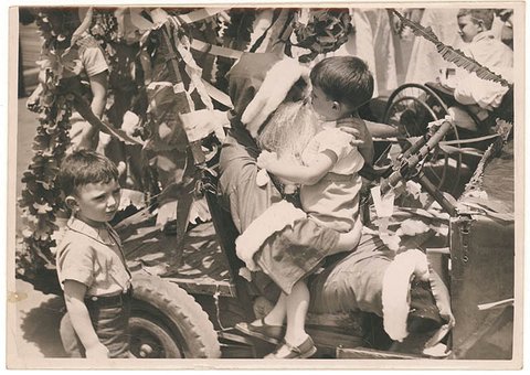 Santa in a jalopy, n.d. - by Sam Hood, 1935