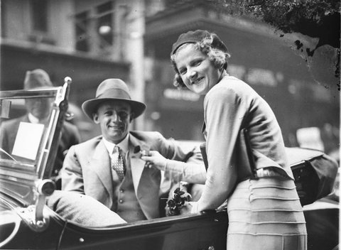Poppy seller pins the flower on cricketer Don Bradman's lapel outside the State Theatre, Sydney, Remembrance Day, early 1930s - photograph by Sam Hood, 1927–30