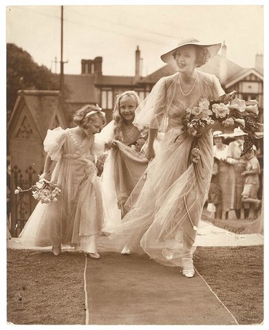Bridesmaid and two flowergirls enter the church, St. Marks, Darling Point, c. 1930s by Sam Hood