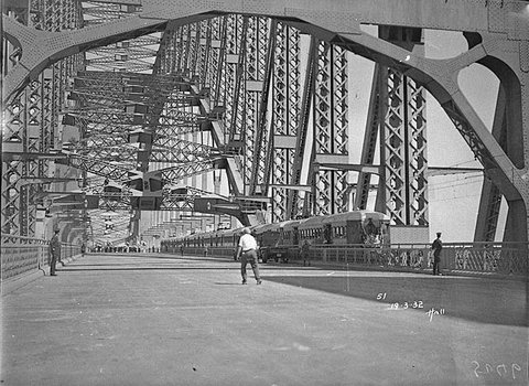 Harbour Bridge with first electric train before official opening, Sydney Harbour Bridge Celebrations, 1932 - photographed by Hall and Co
