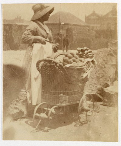 Woman selling fruit from small barrow Sydney, ca. 1885-1890 - photographed by Arthur K. Syer, c. 1887