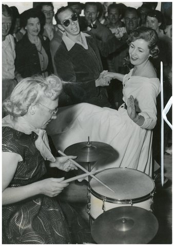 June Howarth of Canterbury and Ray Shart of Bankstown dance to the band with drummer Peg Clark of Blackheath, on the ocean cruise to Broken Bay, South Steyne, December 1953 - Australian Women's Weekly