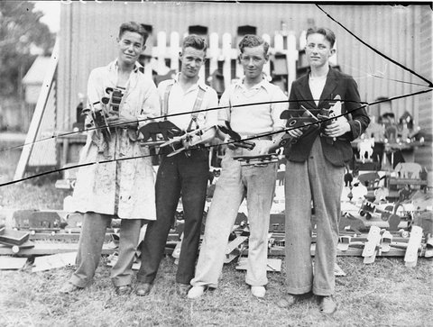 Four unemployed men of Randwick and Coogee with toy wooden aeroplanes made for Christmas 1934, 18 Dec 1934 - by Sam Hood