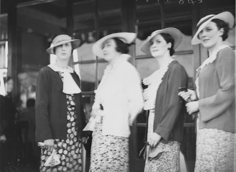 Four women modelling fashion hats, 1920s