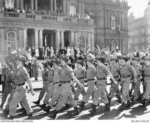 Corps troops with recent service in South Vietnam march past Sydney Town Hall, 1968