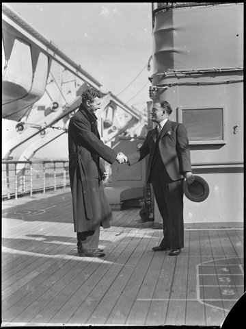 Two men shaking hands on board the SS Mariposa in Sydney Harbour from The Powerhouse Museum, 1930–50