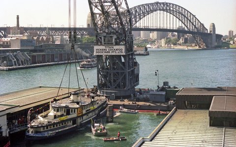 Sydney Ferry KARRABEE being refloated by Titan Crane at Circular Quay 1984