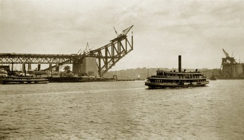 Sydney Ferry KUBU approaches Circular Quay and Harbour Bridge under construction Sept 1929