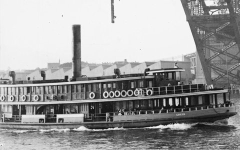 Sydney ferry KUBU under the Sydney Harbour Bridge under construction circa 1930, c. 1930