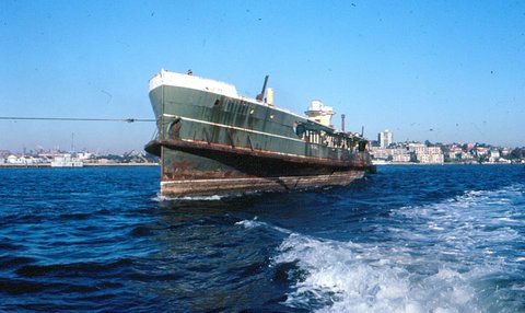 Sydney ferry BELLUBERA hulked and being towed to sea for scuttling 1 August 1980